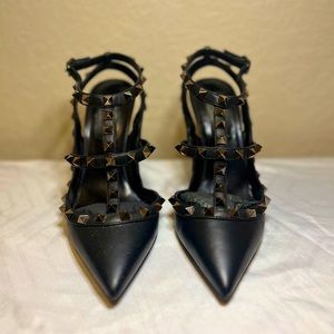 Black leather ankle strap Valentino studded stiletto heels.